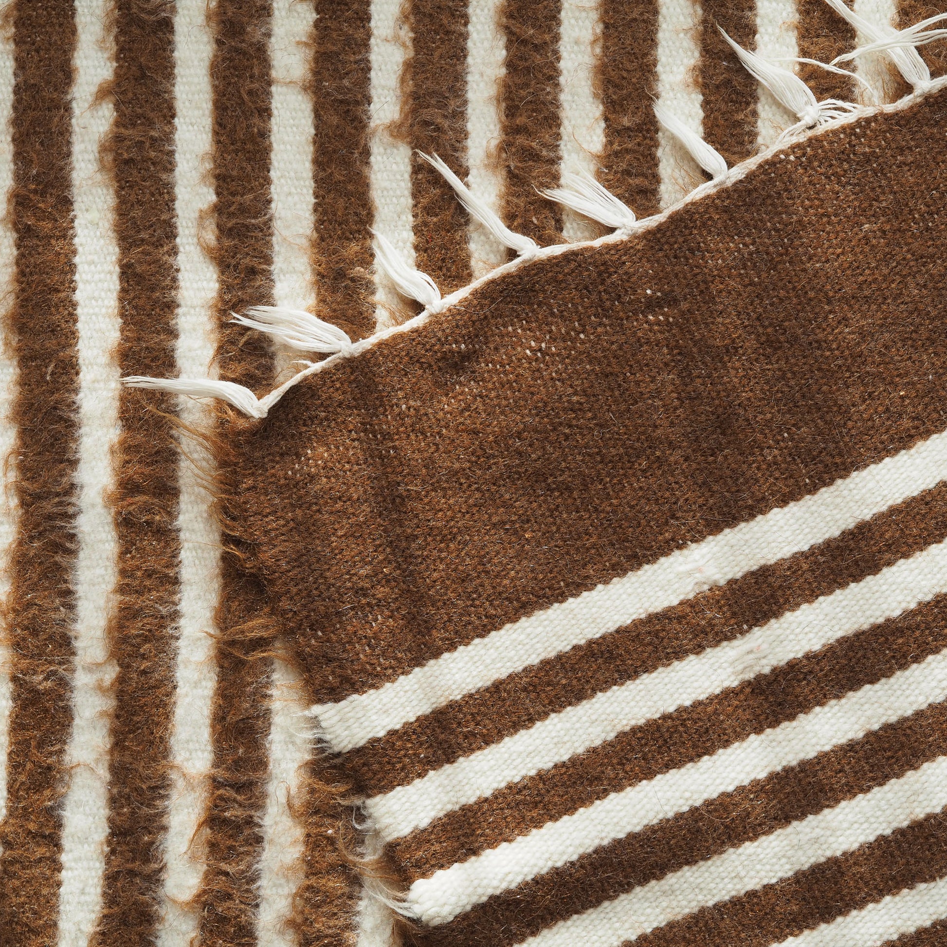 brown-white-striped-wall-hanging-rug